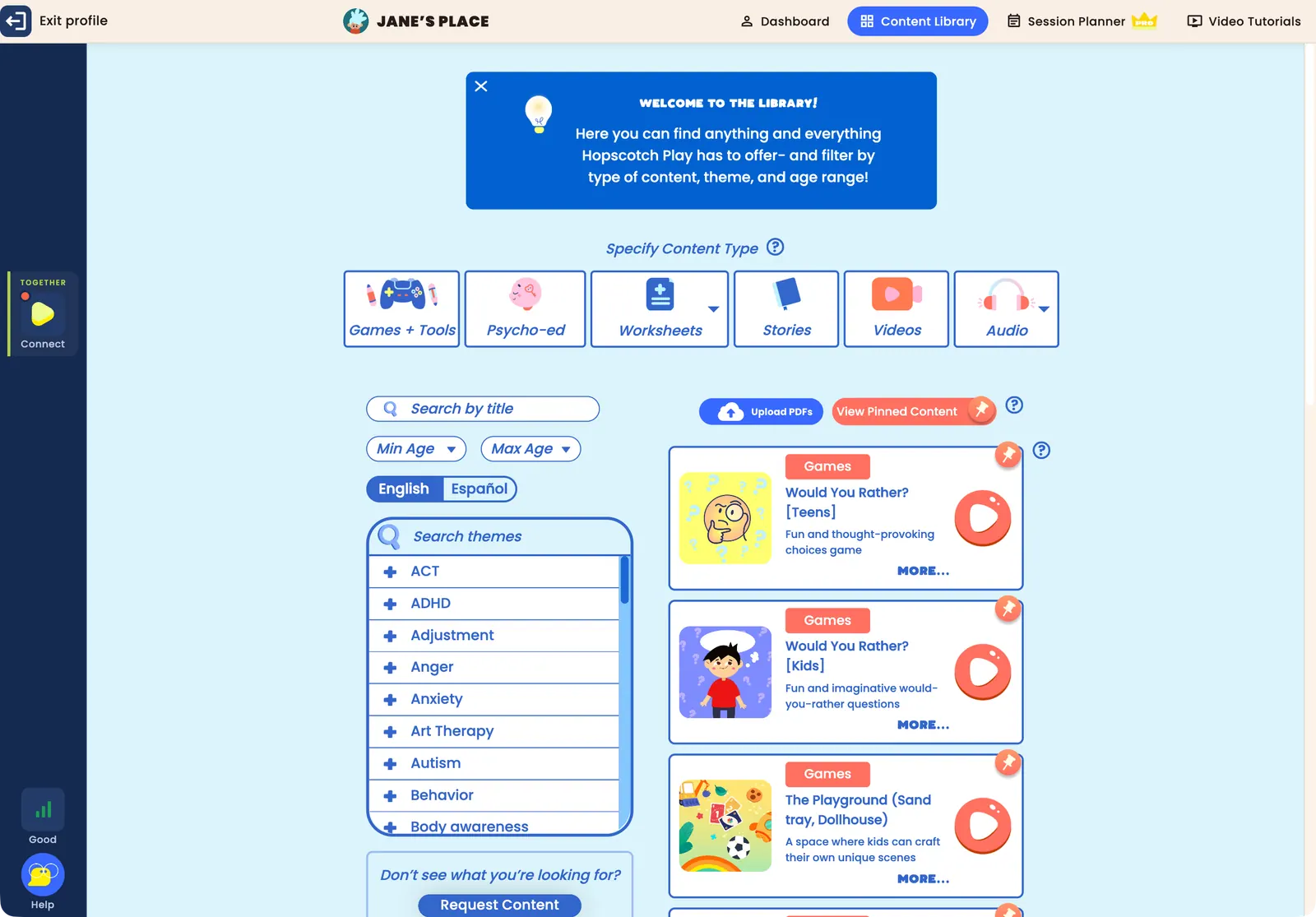 The Content Library inside a client's profile: content type buttons for Games + Tools, Psycho-ed, Worksheets, Stories, Videos and Audio, search by title, minimum and maximum age, the English and Español toggle, the themes list, Upload PDFs and View Pinned Content, and content cards with pin icons