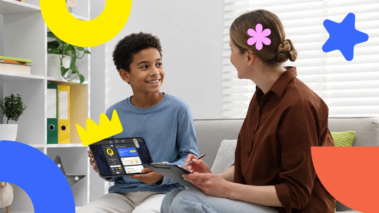 A clinician and child playing on one shared device
